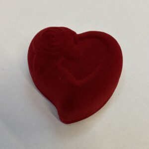 Heart shaped flocked ring box with embedded flower on the lid.