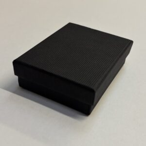 Quality Cardboard No 6 Nested box with a matt black corded texture.
