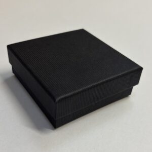 Quality Cardboard Medium Universal box with a matt black corded texture.