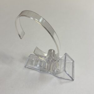 Adjustable watch clip stand in clear plastic. Pkts of 5.